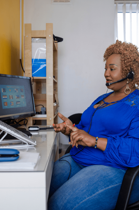 african american woman at a computer working with multiple cultures